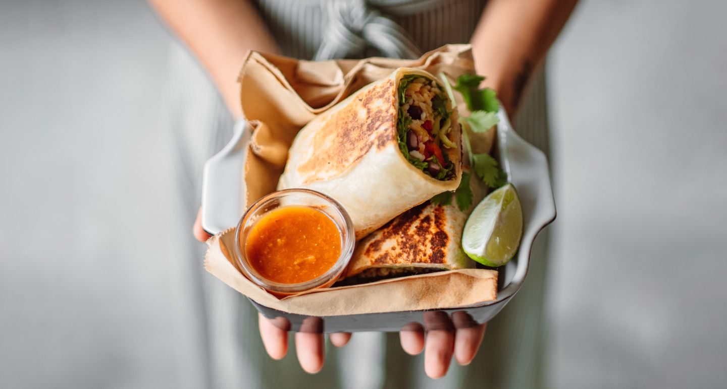 Hands carrying food