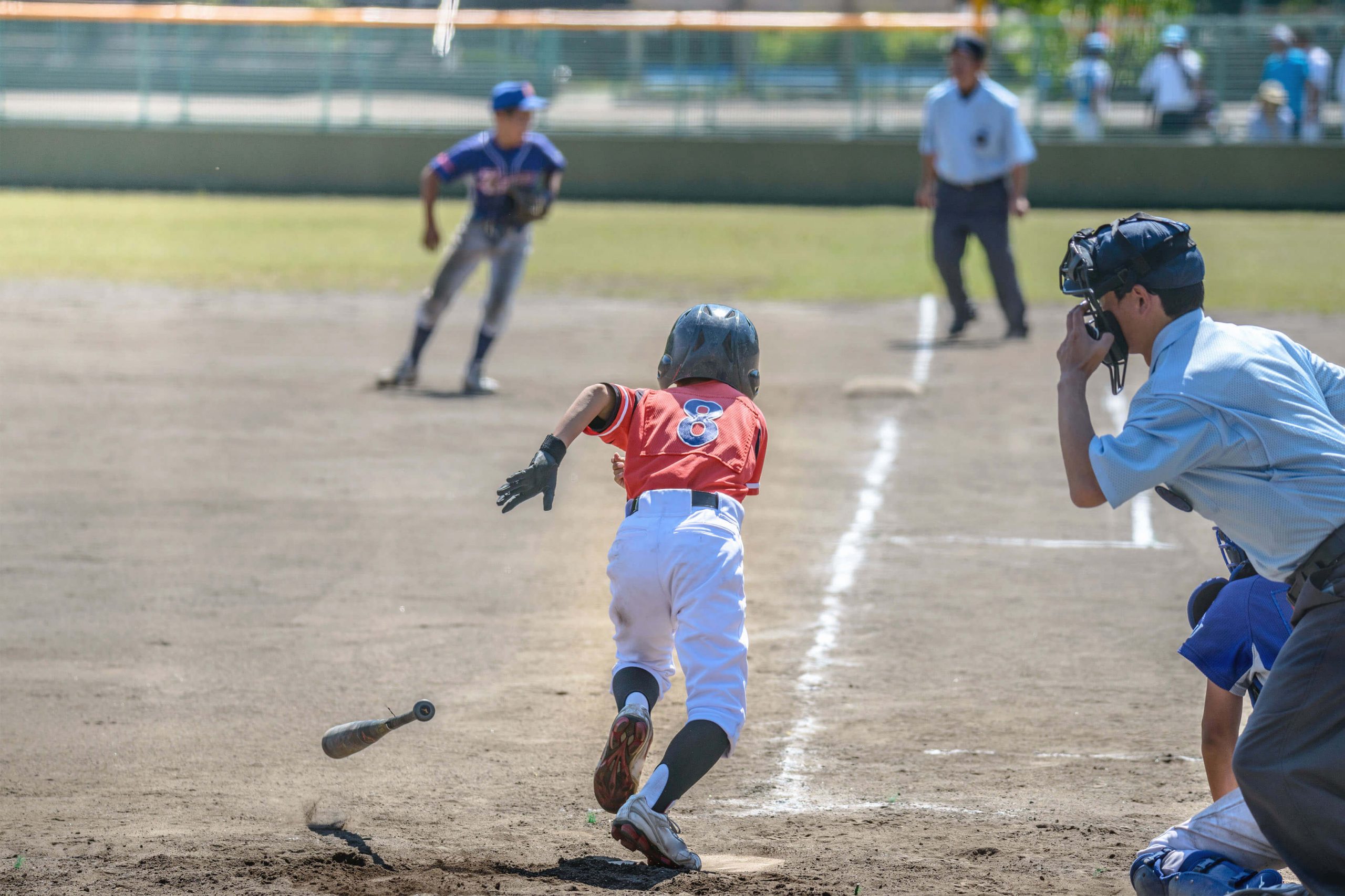 Youth Baseball Player Starts Running to the next base