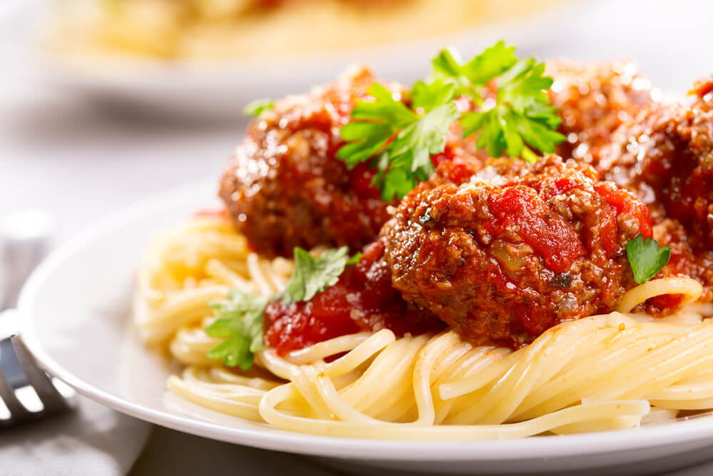 A plate of spaghetti and meatballs