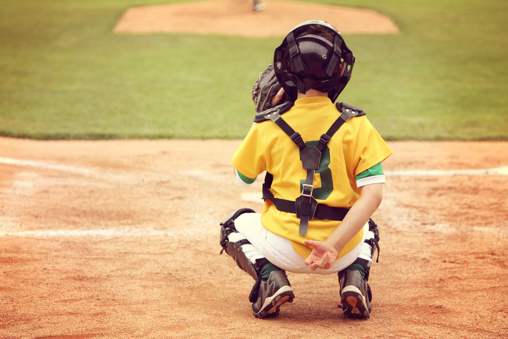 Youth Baseball Pitcher Receiving a Pitch