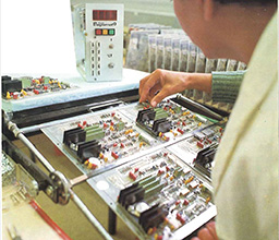 a KEBA employee in front of a control