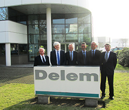Managers in front of the DELEM building
