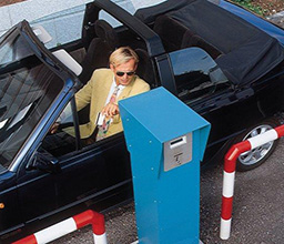 Man in a car using the access control system