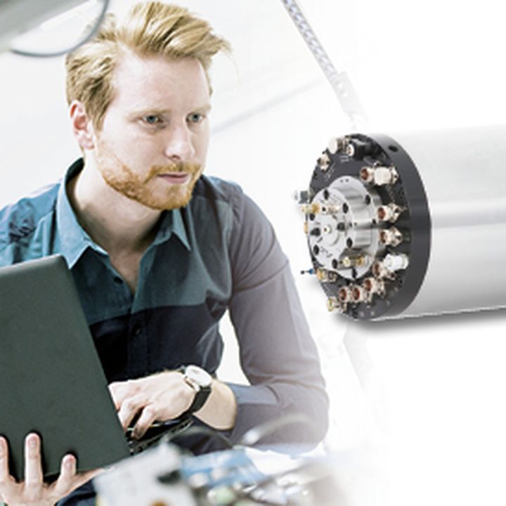 Picture showing an engineer with laptop and spindle