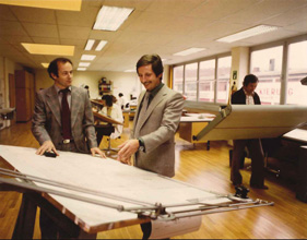 Two men in a technical disussion