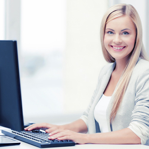 Woman working at a computer.