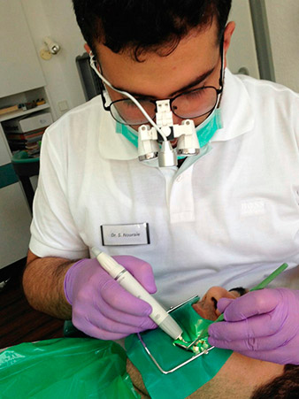 dental loupes or a surgical microscope  dental loupes or a surgical microscope