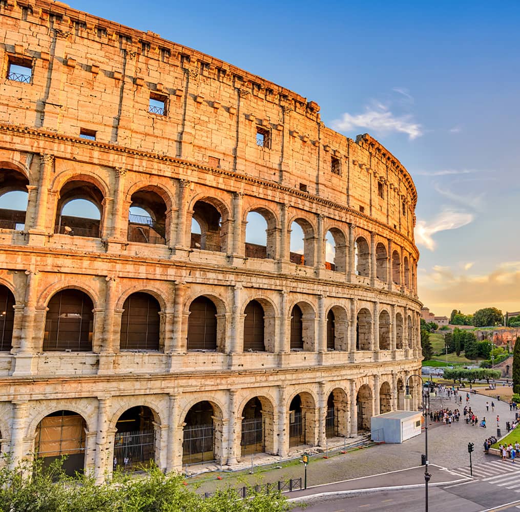 The outer details of ancient colosseum ruins during a clear day