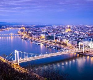 Aerial view of a city along a river at night