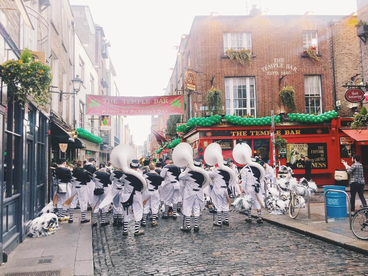 A parade goes by the Temple Bar in Dublin, Ireland.