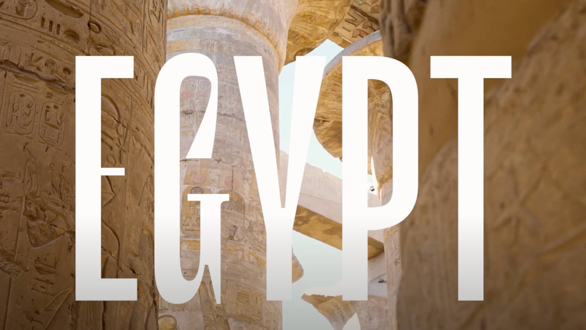 “Egypt” text over columns painted and carved with hieroglyphs. 