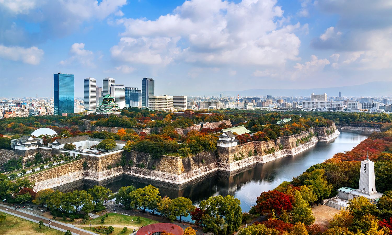 An overhead view of the Osaka Museum of History, Osaka Castle, and the Osaka skyline.