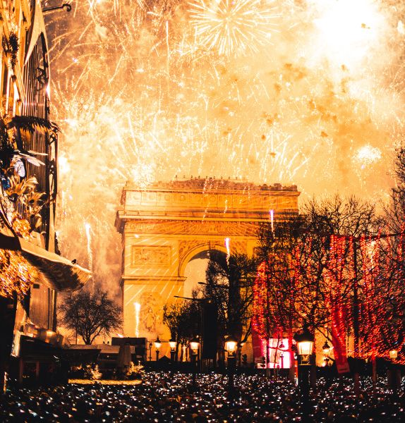 Fireworks going off above the Arc de Triomphe in Paris.