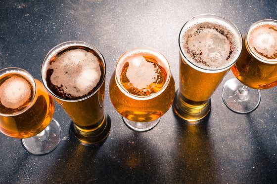 five glasses full of beer