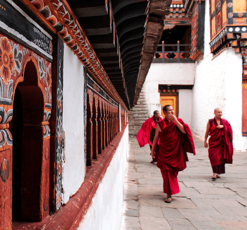 Monks walking in monastery in Paro Bhutan