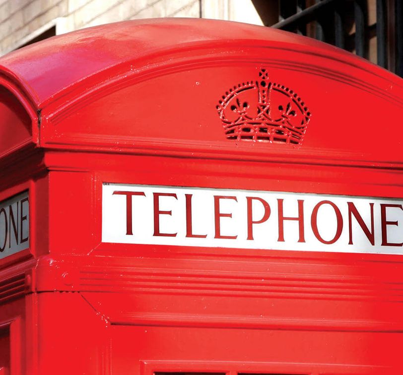 top of red phone booth in london