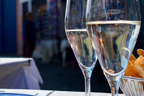 Glasses of prosecco with views of Italian streets