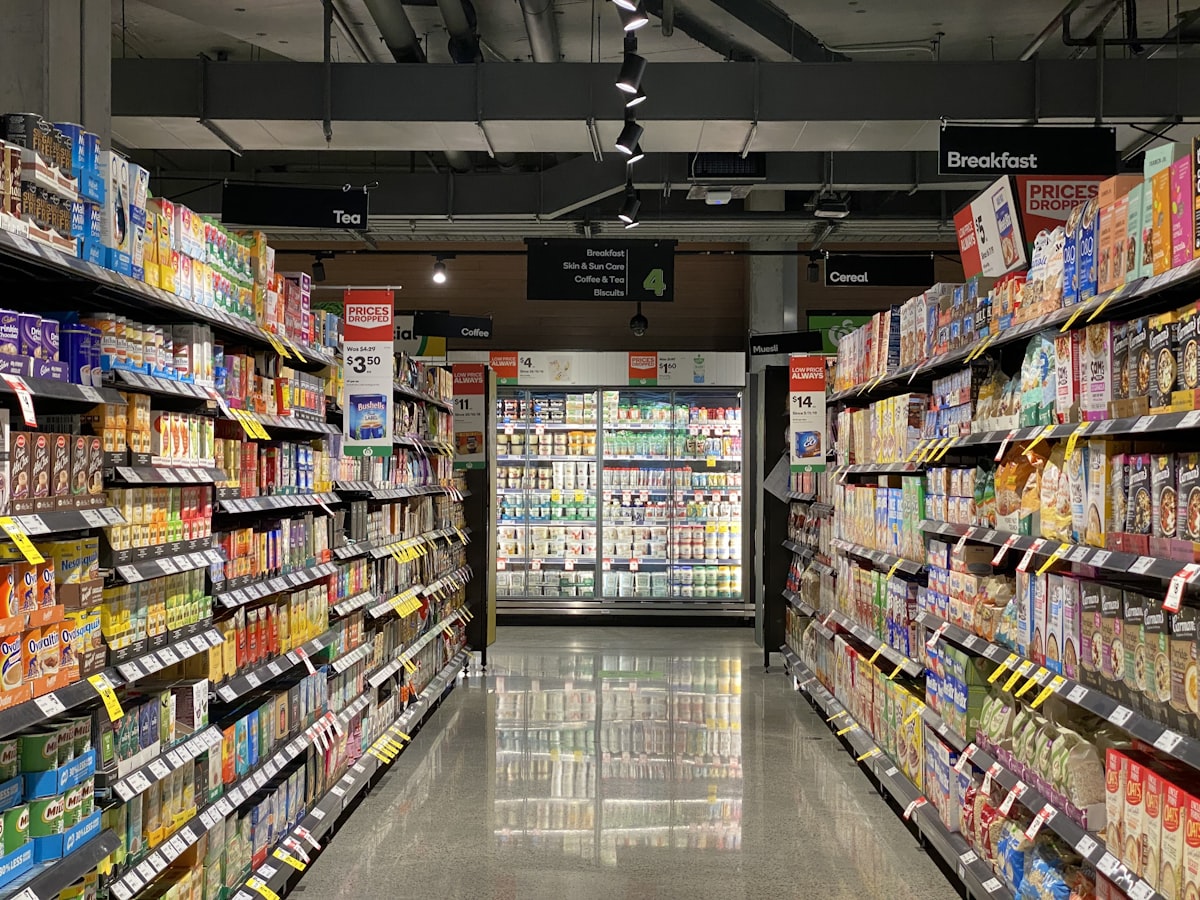Retail employees standing idle on a quiet store floor