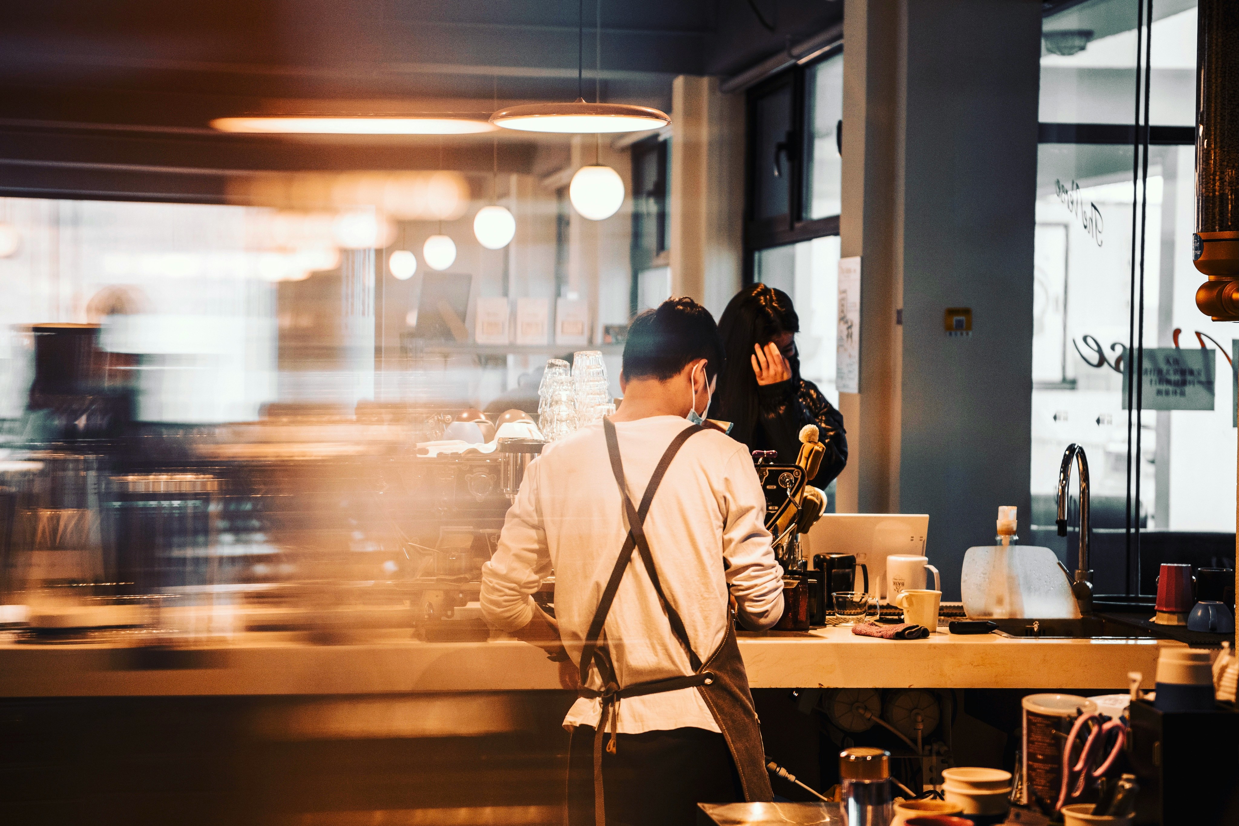 Cafe team working a busy counter during peak service