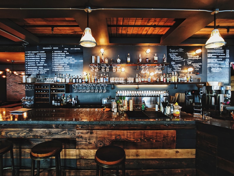 Baristas collaborating behind the counter of a busy cafe