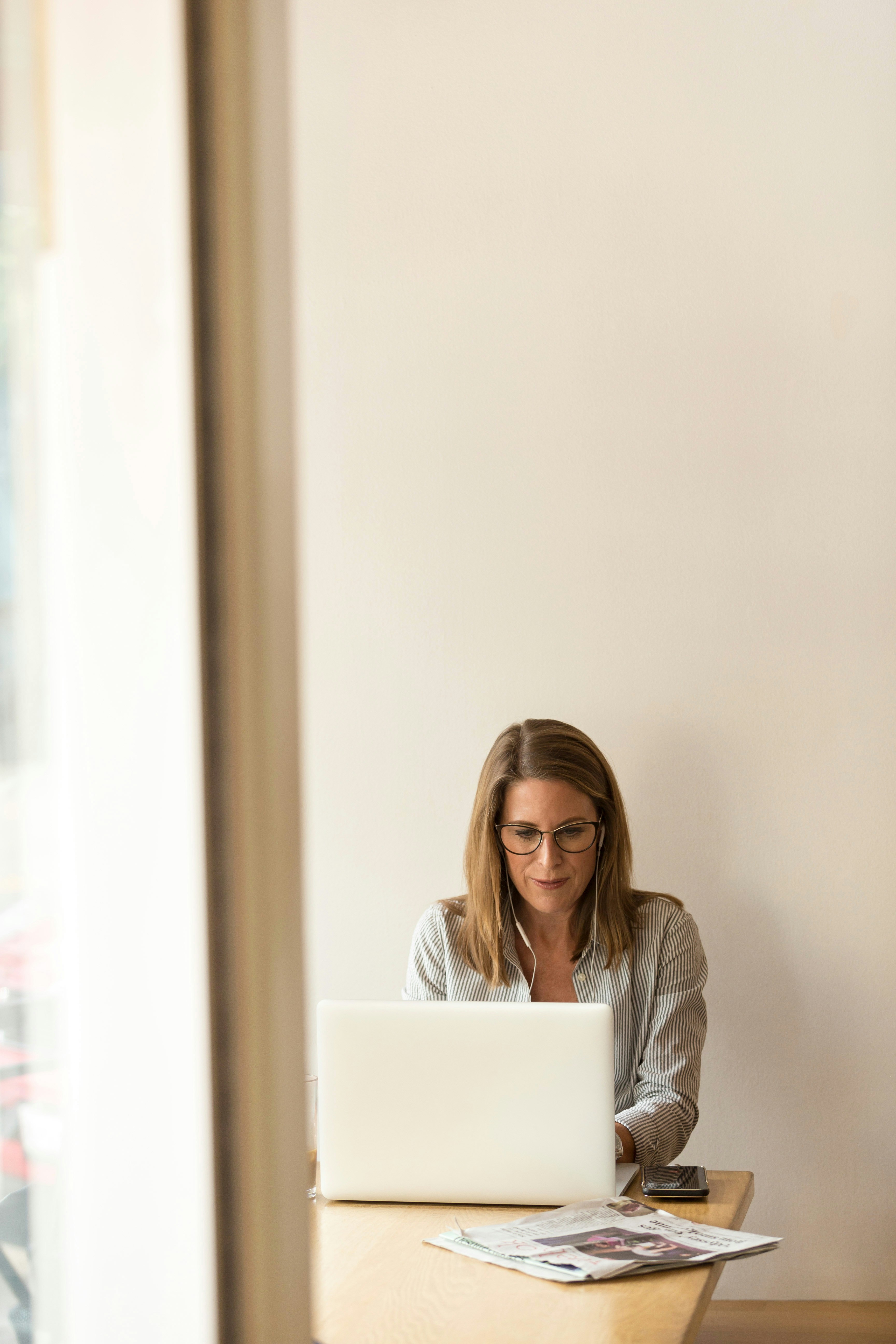 Manager reviewing an employee work rota on a laptop