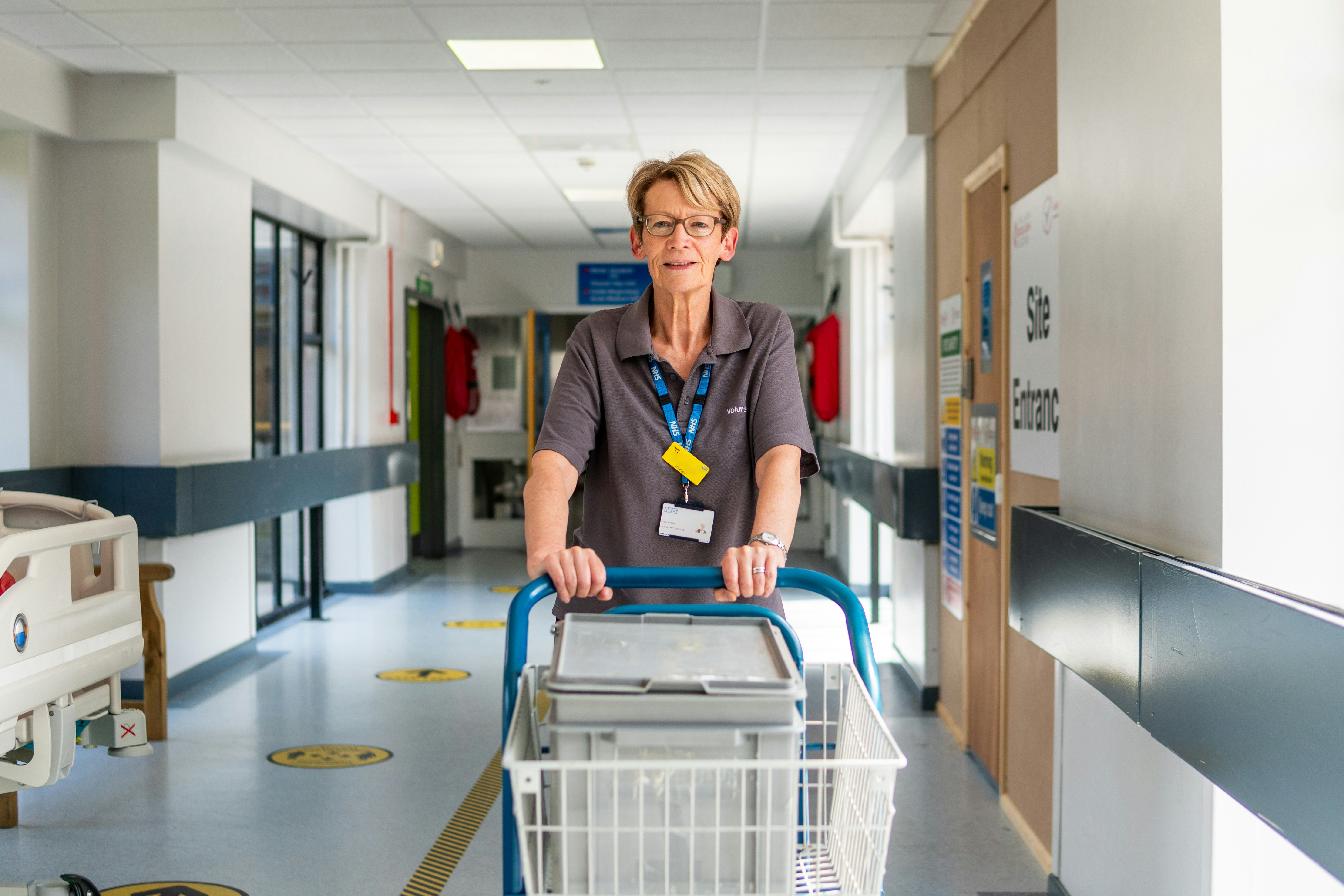 Care team moving through a hospital corridor during a shift change