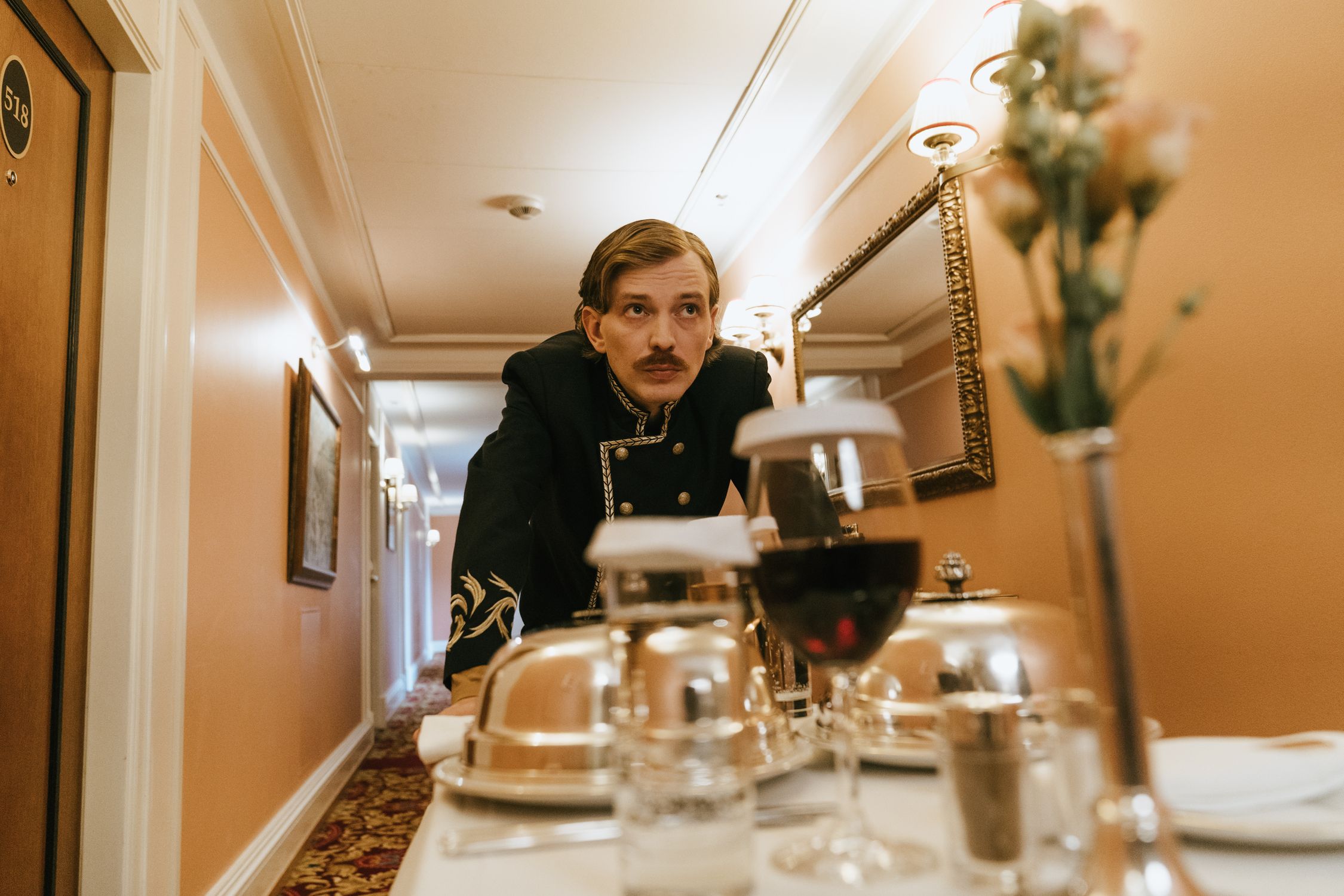 Hotel front desk staff working at reception during evening shift