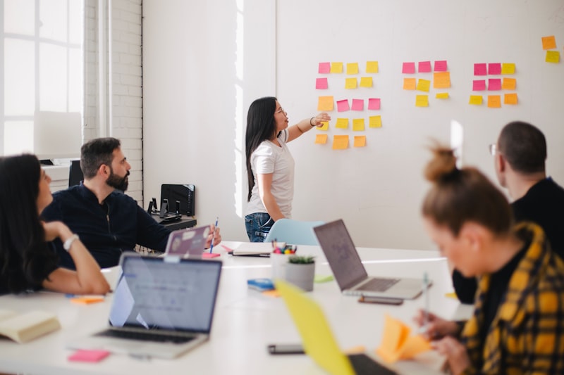 Team meeting in a modern workplace with a manager leading a discussion