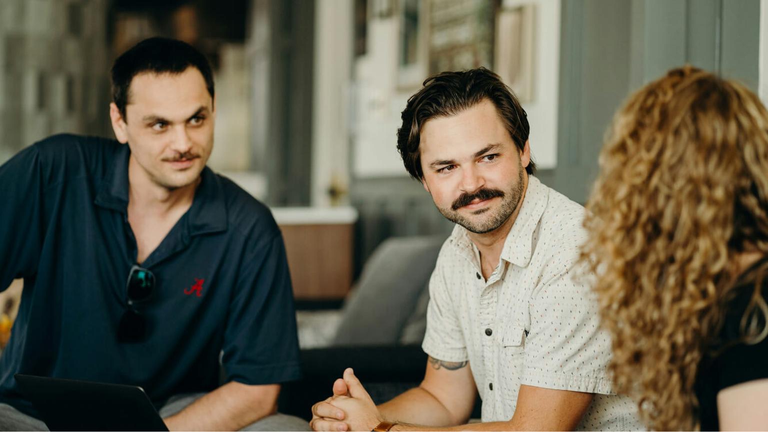 Marketing Research Interns discussing during an office meeting