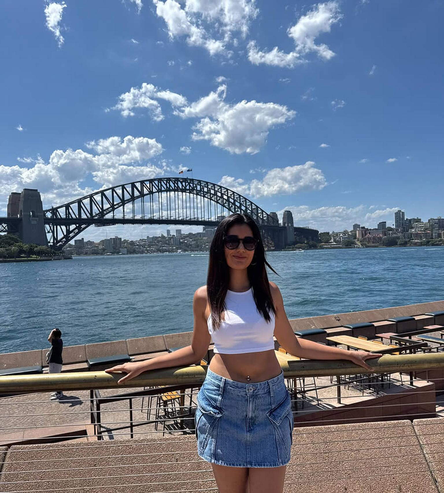 Sandip in front of Sydney's famous harbour bridge during her internship abroad
