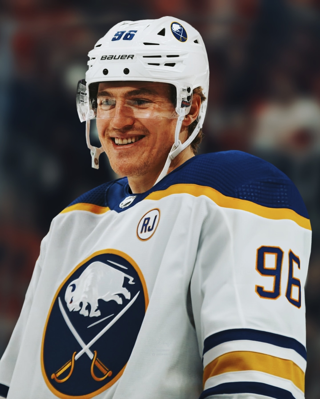 Buffalo Sabres Nicolas Aubé Kubel smiles in white away jersey with RJ memorial patch.