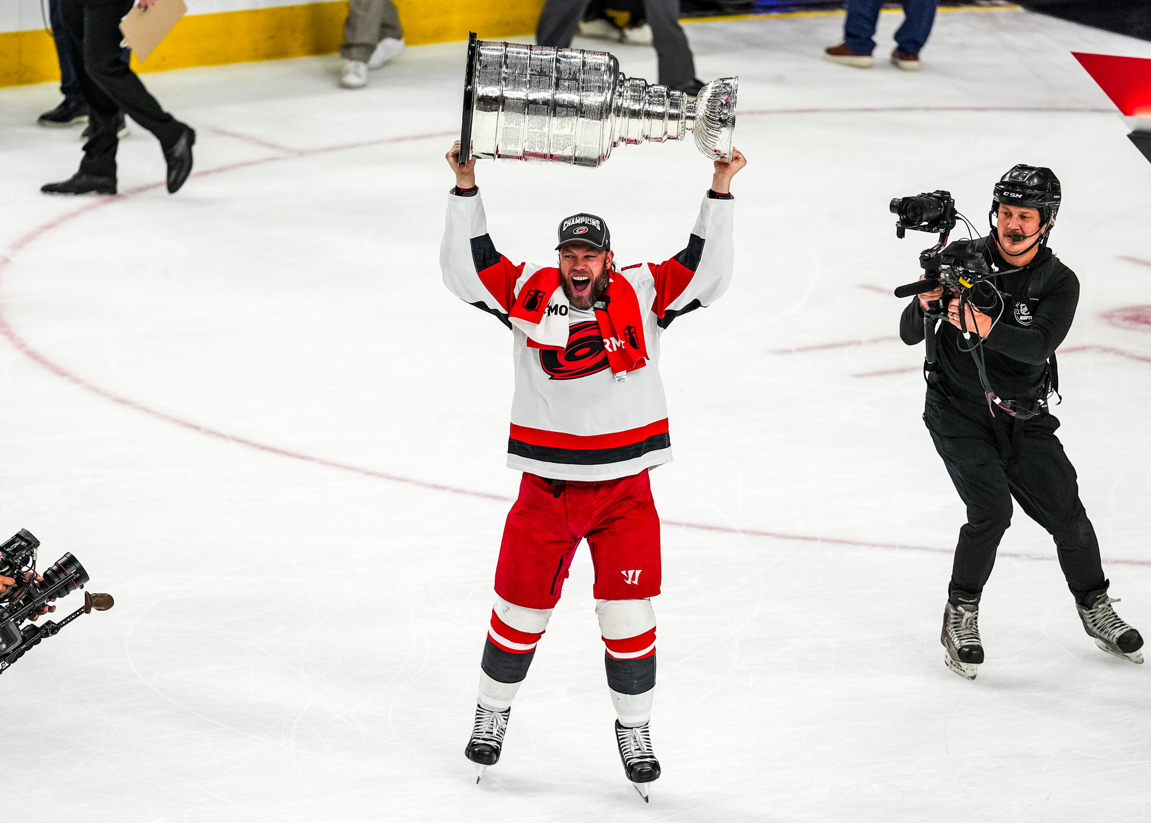Taylor Hall lifting the Stanley Cup with the Carolina Hurricanes.