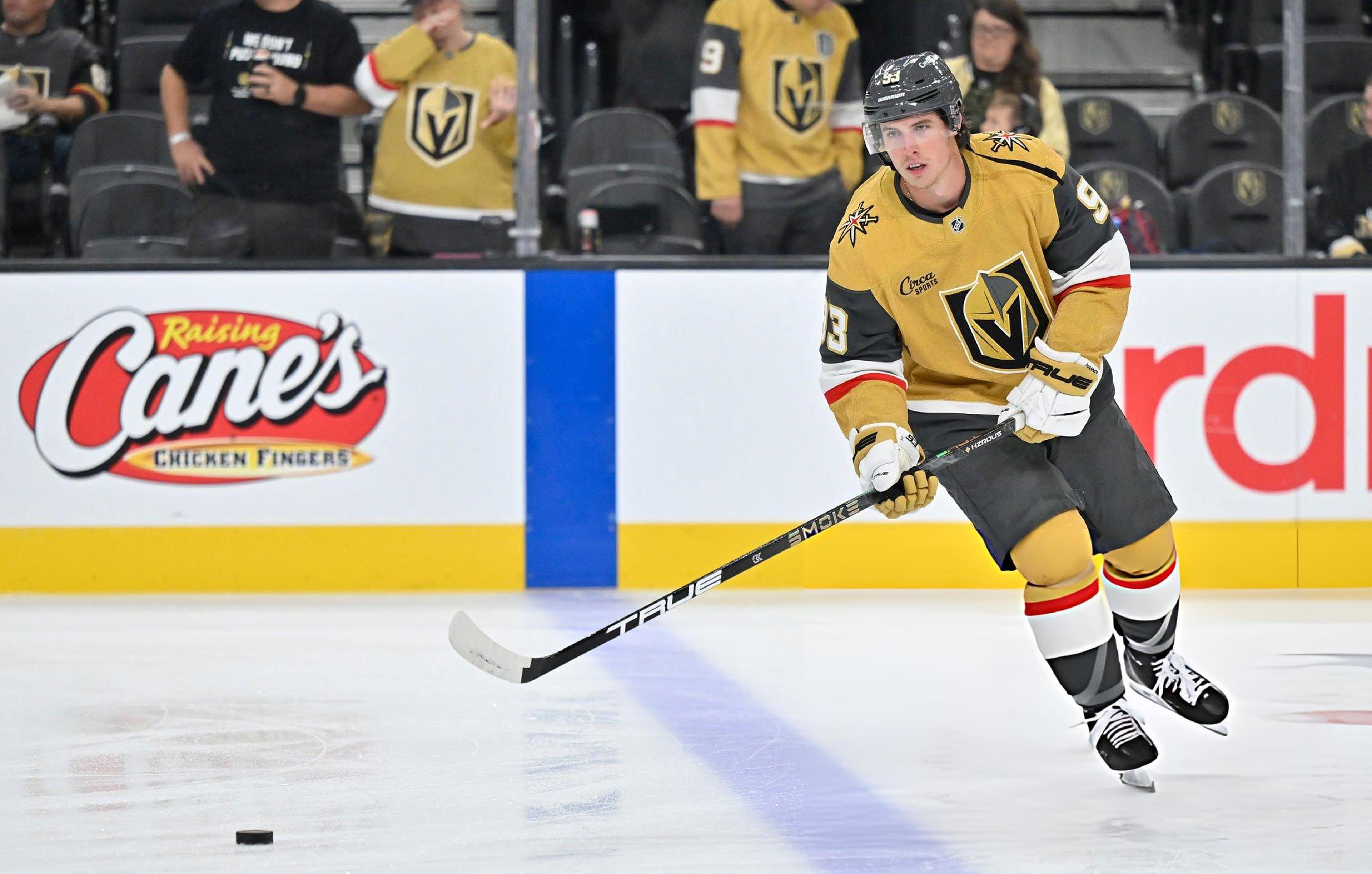 Mitch Marner in gold Golden Knights gear.