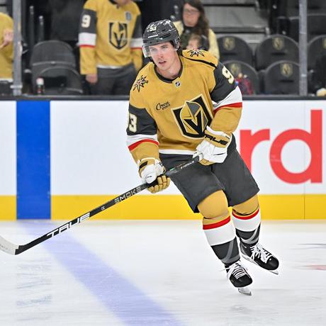 Mitch Marner in gold Golden Knights gear.