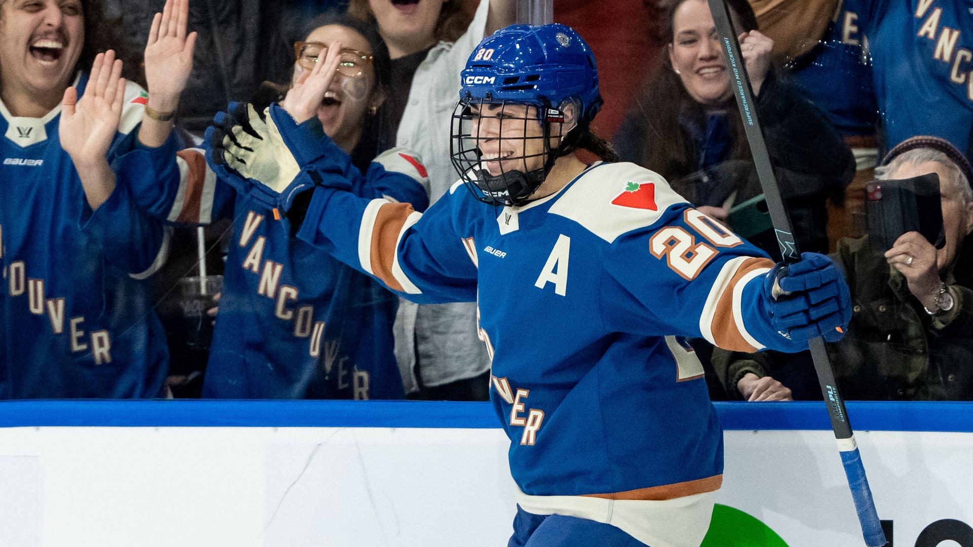 Sarah Nurse in blue Goldeneyes jersey celebrates with raised arms.