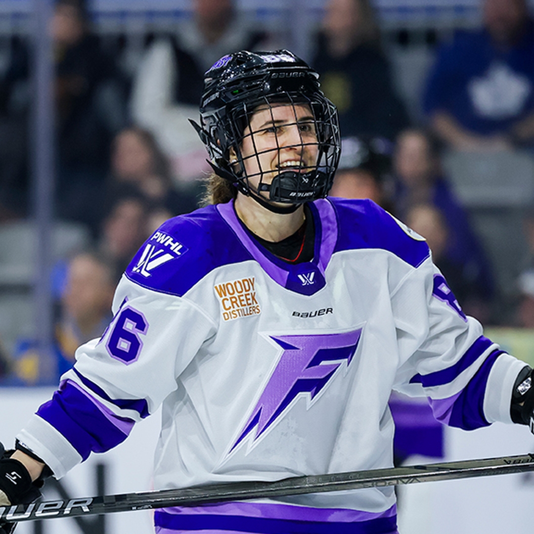 Michela Cava smiling in a Minnesota Frost jersey