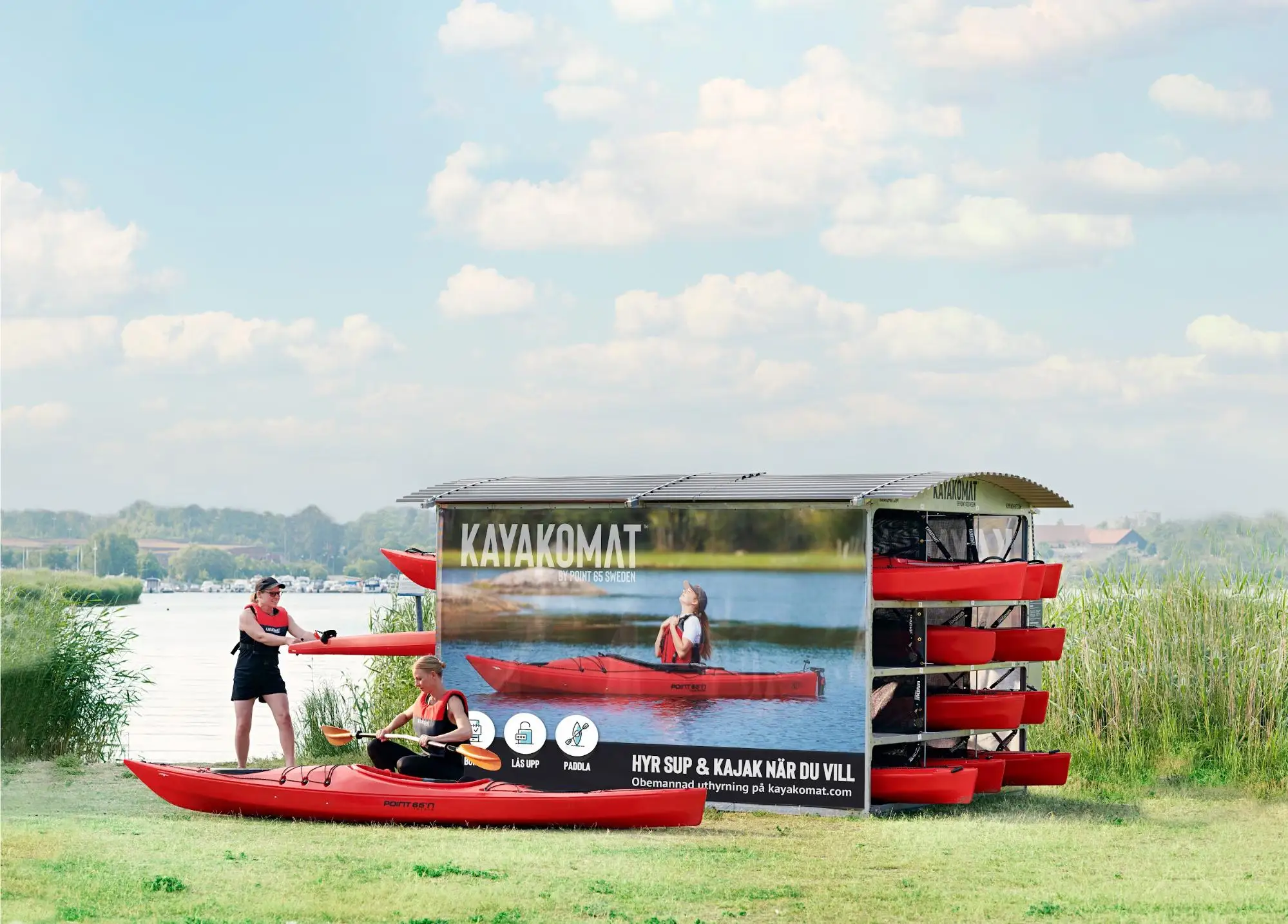 Kayakomat self-service kayak racks beside the water
