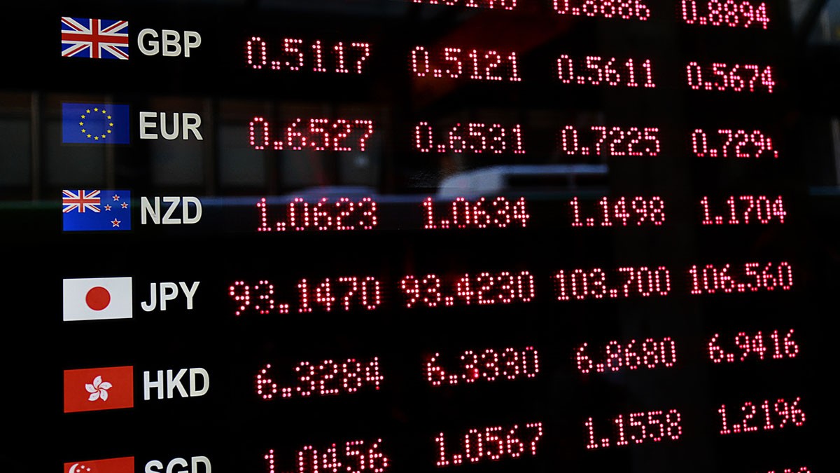 What makes currencies and exchange rates fluctuate?