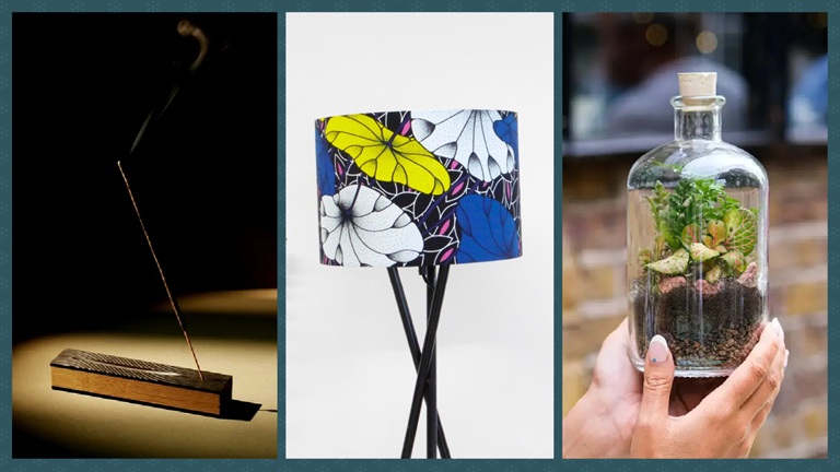 Homewares: unique home gifts from local creatives Incense burning on a wooden holder, a colourful floral lampshade and a hand holding a glass terrarium with plants inside.