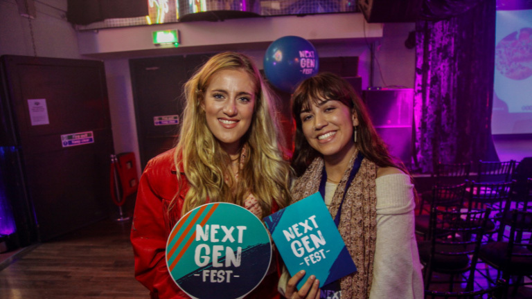 Next Generation Buckinghamshire: Access a free training bootcamp and win grants Image of two women at an event holding signs that say 'Next Gen Fest'