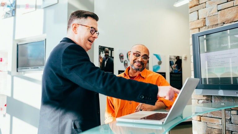 A small business owner upselling