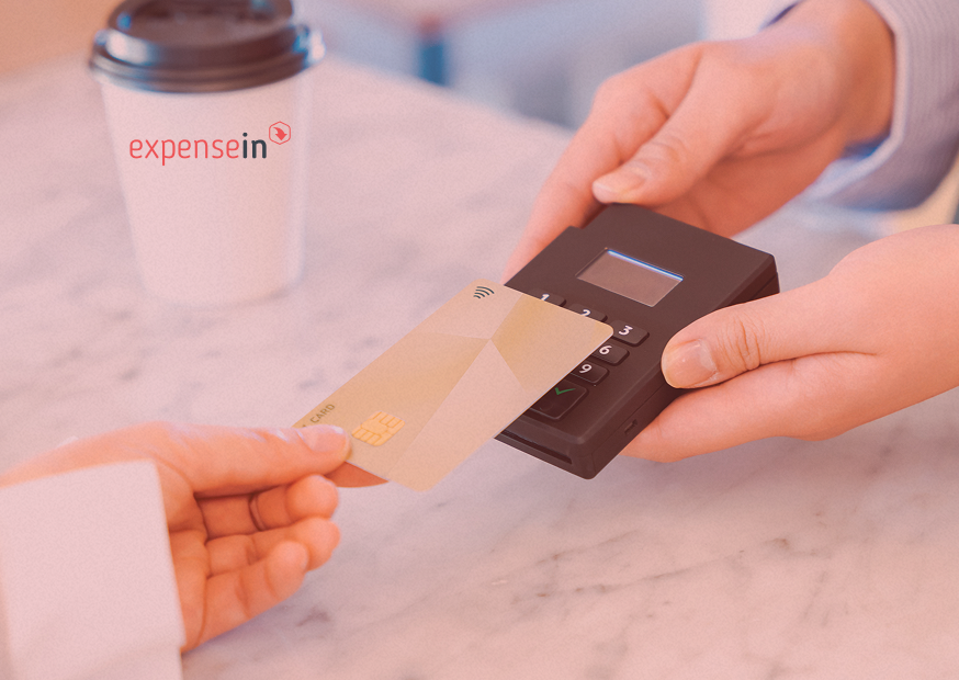 Person making a contactless payment with a card on a portable card reader.