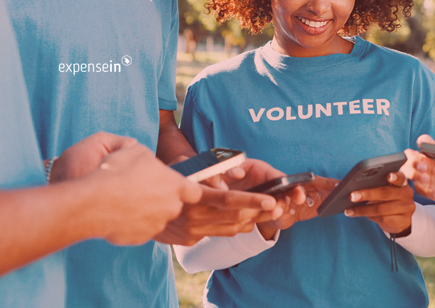 Volunteers looking at their phones.