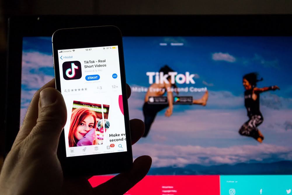 Smartphone displaying the TikTok app, illustrating TikTok affiliate marketing on mobile devices.
