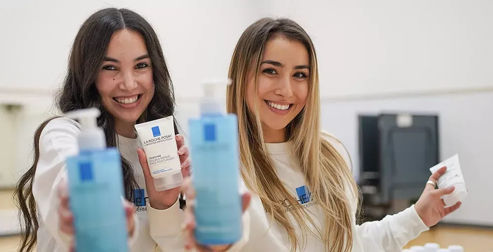 A picture of two woman holding La Roche-Posay's products