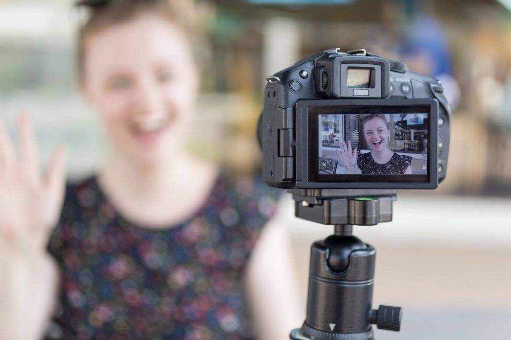 A young influencer creating a video blog (vlog)