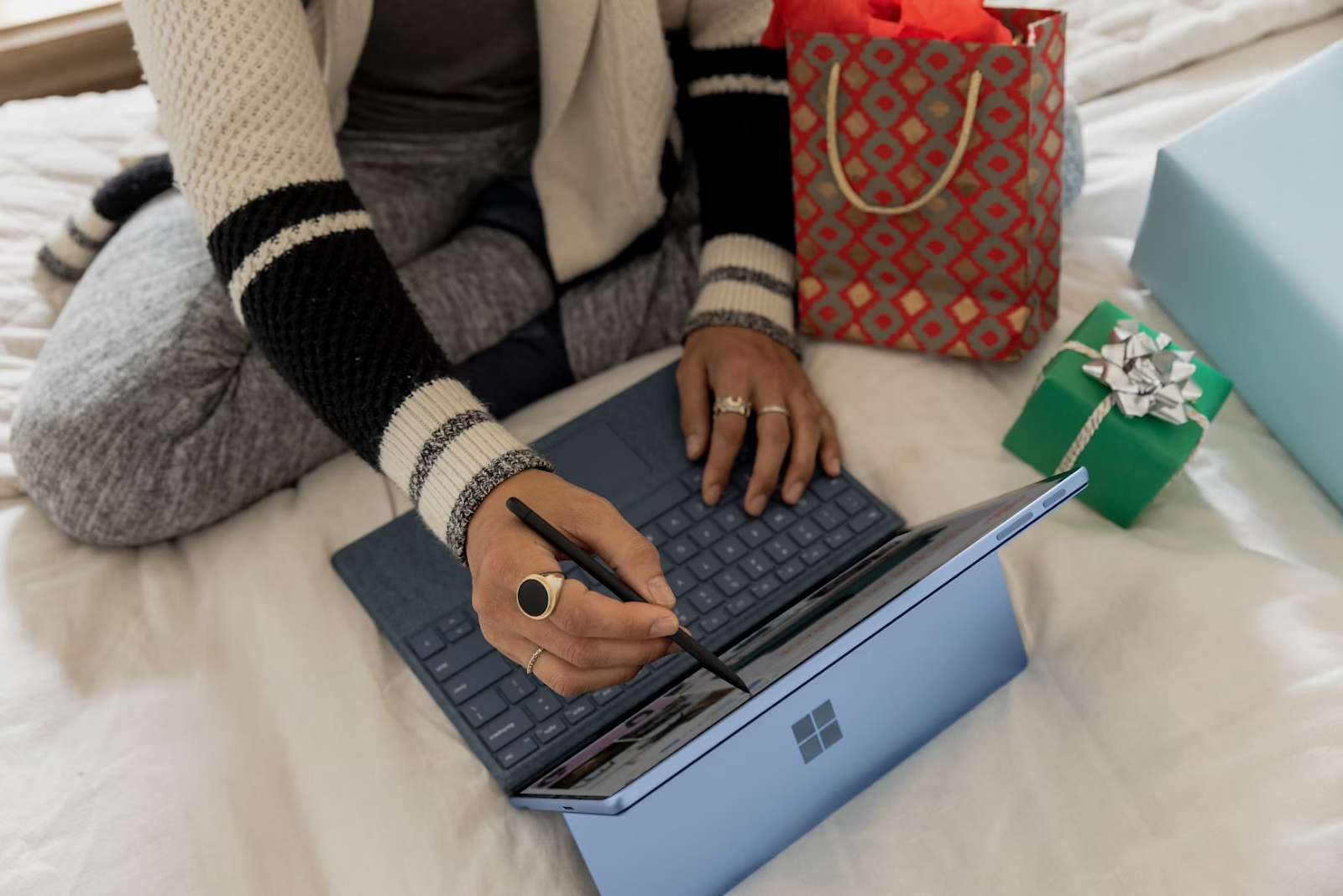 a woman operating her touchscreen laptop to connect with customers
