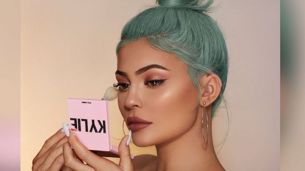 A picture of Kylie Jenner showcasing her own beauty product