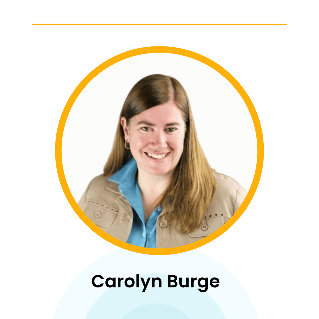Smiling woman with long hair, wearing a beige jacket and blue shirt. Name displayed below: Carolyn Burge. White background with yellow circular border.