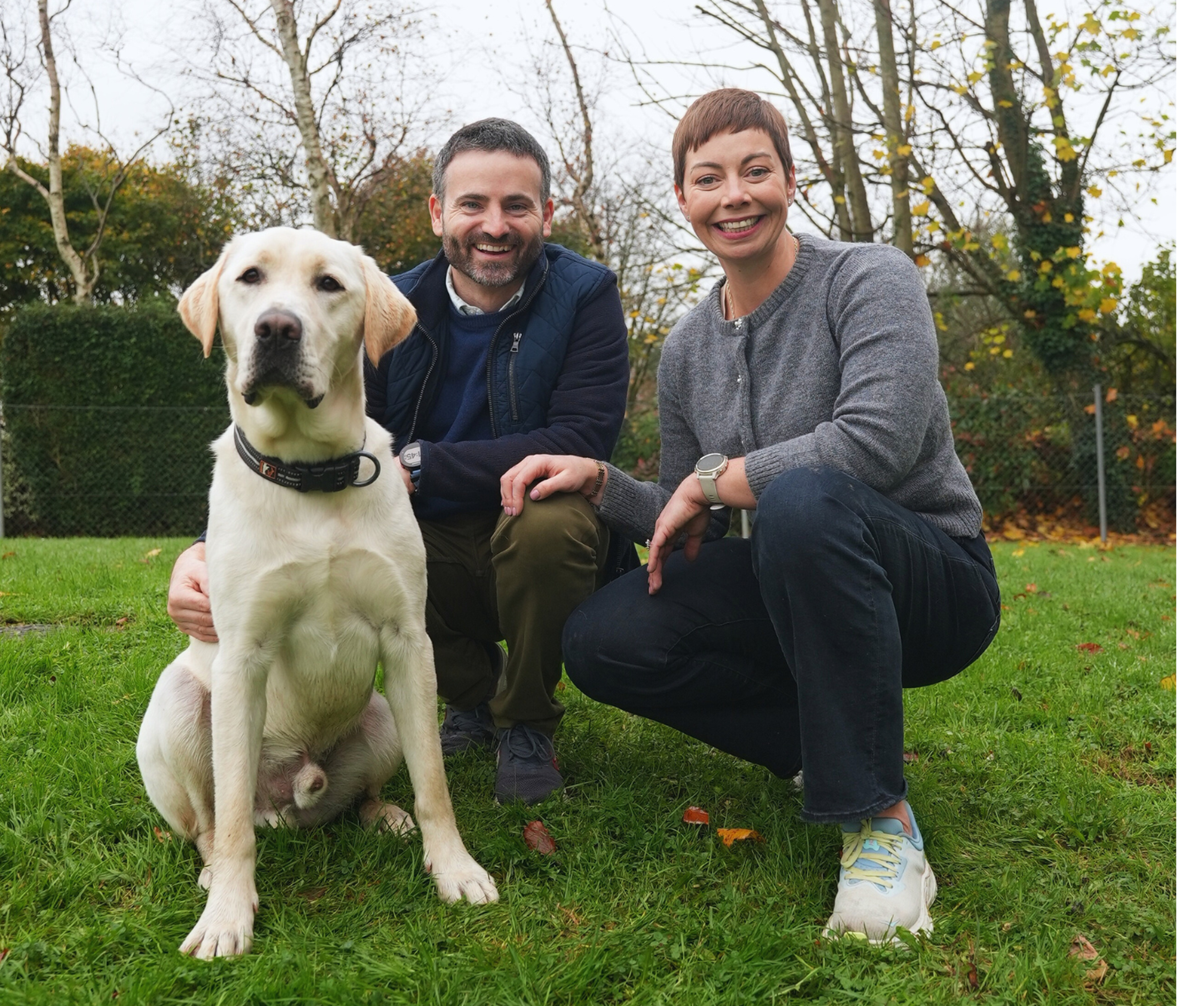 Guide Dog Nelson pictured with his Puppy Raisers James and Niamh